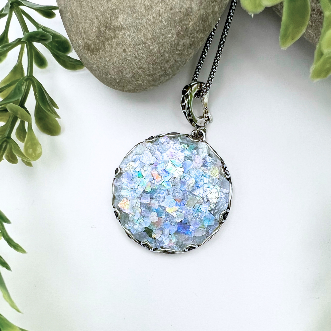 Large circular Roman Glass Necklace with an intricate clasp bail - the setting isn't too noticeable from the front but has a looped vined design.
