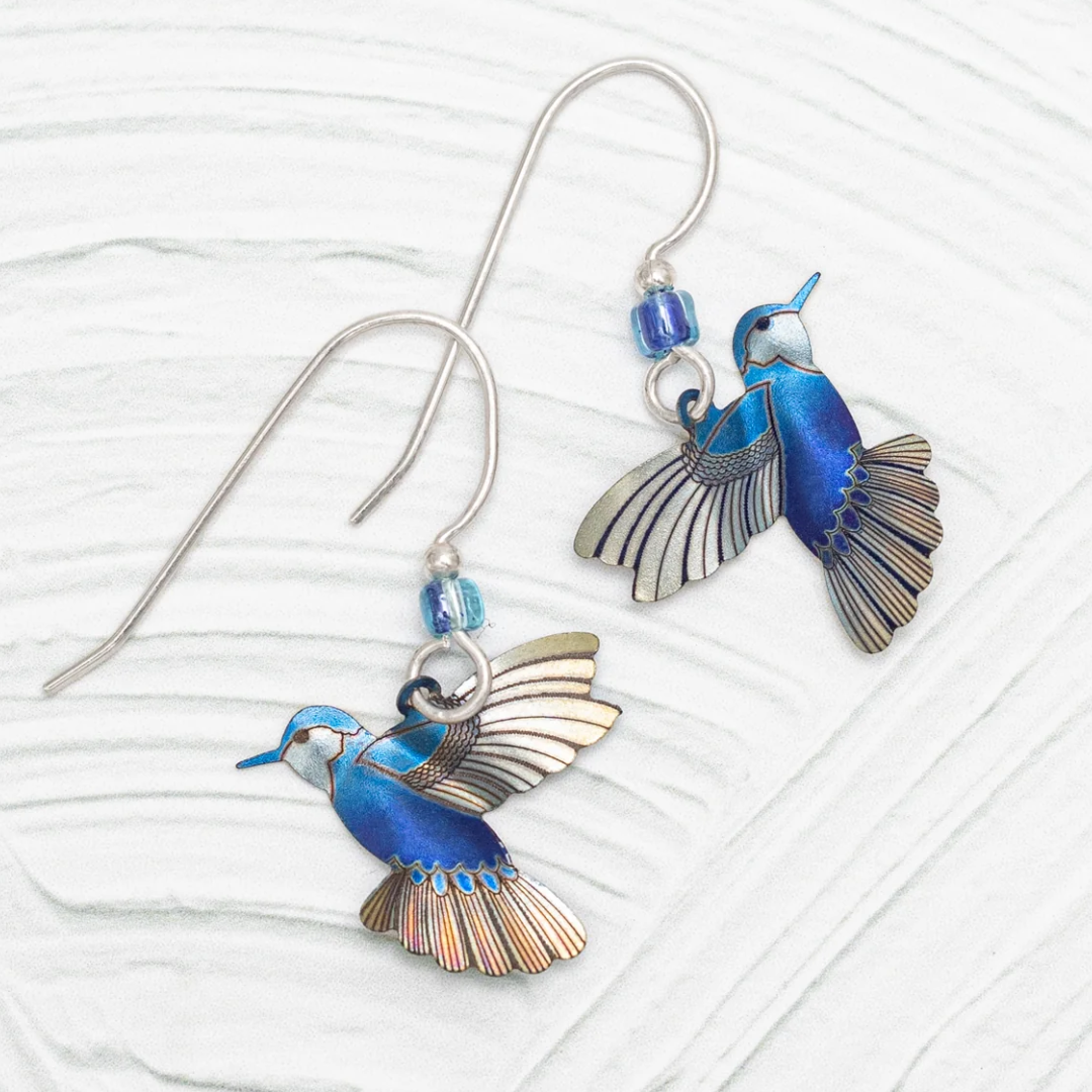 Holly Yashi Picaflor Hummingbird Dangles made out of Niobium. Color is Blue Radiance with 925 Sterling Silver earwires adorned with a blue Swarovski crystal.
