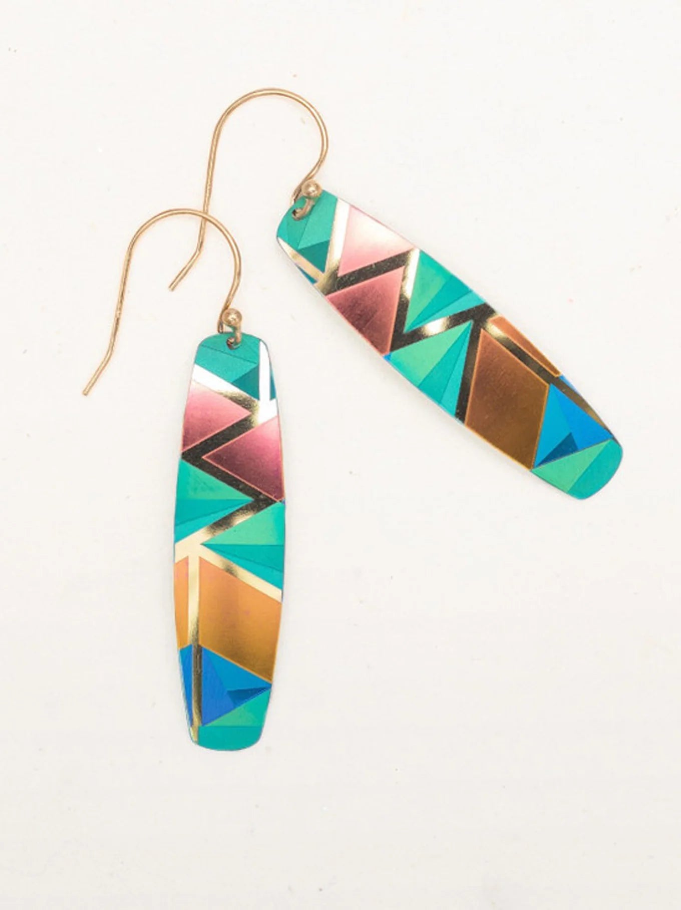 The Holly Yashi Del Rey Earrings are a pair of elongated, multicolored beauties featuring an abstract geometric pattern. Their design showcases vibrant shades of turquoise, gold, pink, and blue, perfectly complemented by gold-colored hooks for fastening.