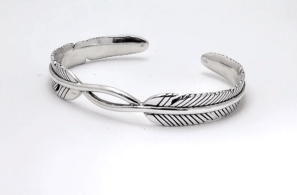 silver cuff bracelet with feather design