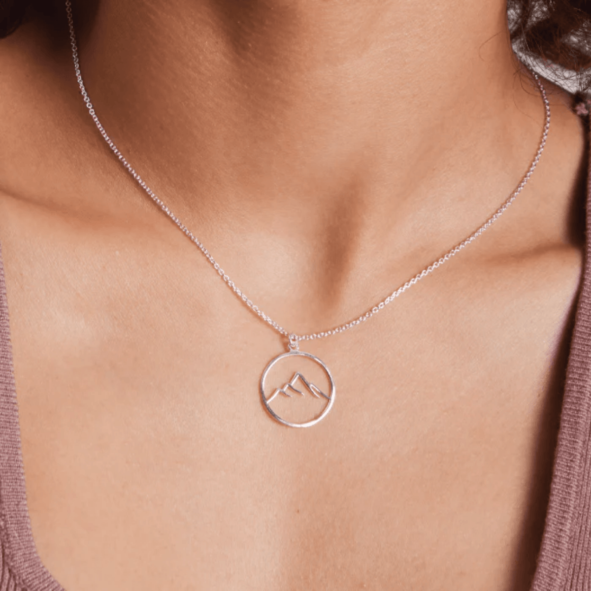 boma Sterling Silver Mountain Pendant. Great mountain image on a round sterling silver pendant . Pendant includes the chain shown.- Silver Parrot, Inc. /Urbansterlingsilver.com
