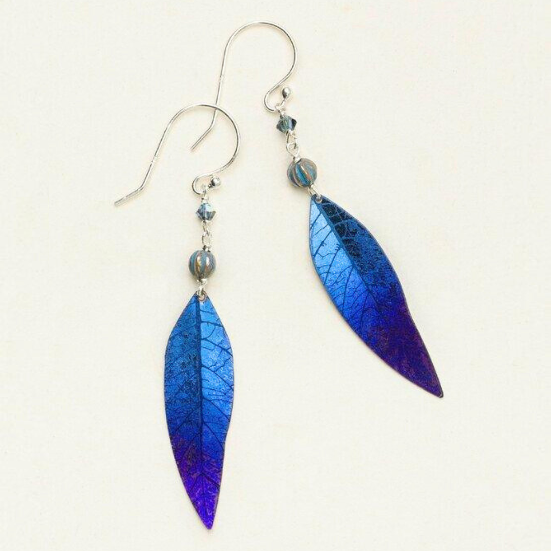 Holly Yashi Shimmering Willow - Navy Blue leaf dangle earring with venations etched into the metal work. At the top of the leaf are two blue beads with gold stripes, separated by a silver chain on a silver ear wire.