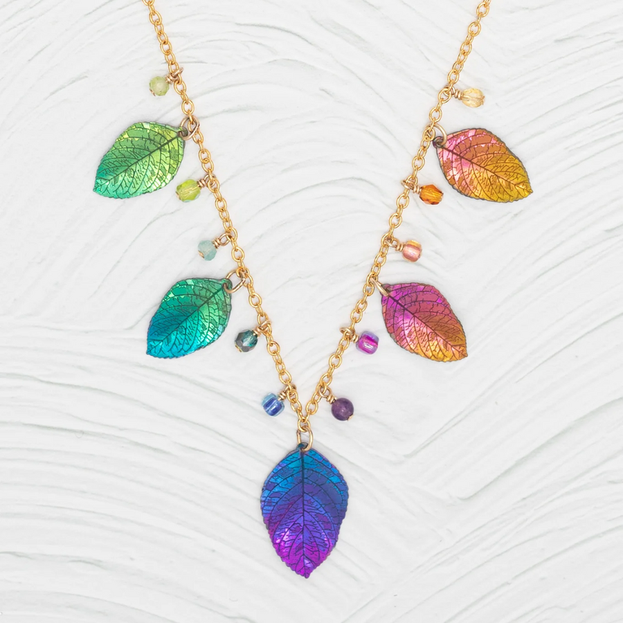 Holly Yashi Healing Elm Leaf Necklace - Color Rainbow - 18k gold-plated and niobium with crystal, glass, peridot, and apatite drops. 