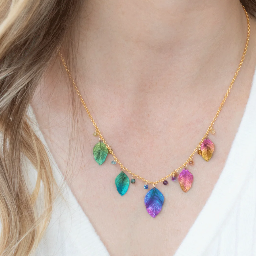 Holly Yashi Healing Elm Leaf Necklace - Color Rainbow - 18k gold-plated and niobium with crystal, glass, peridot, and apatite drops - shown on model