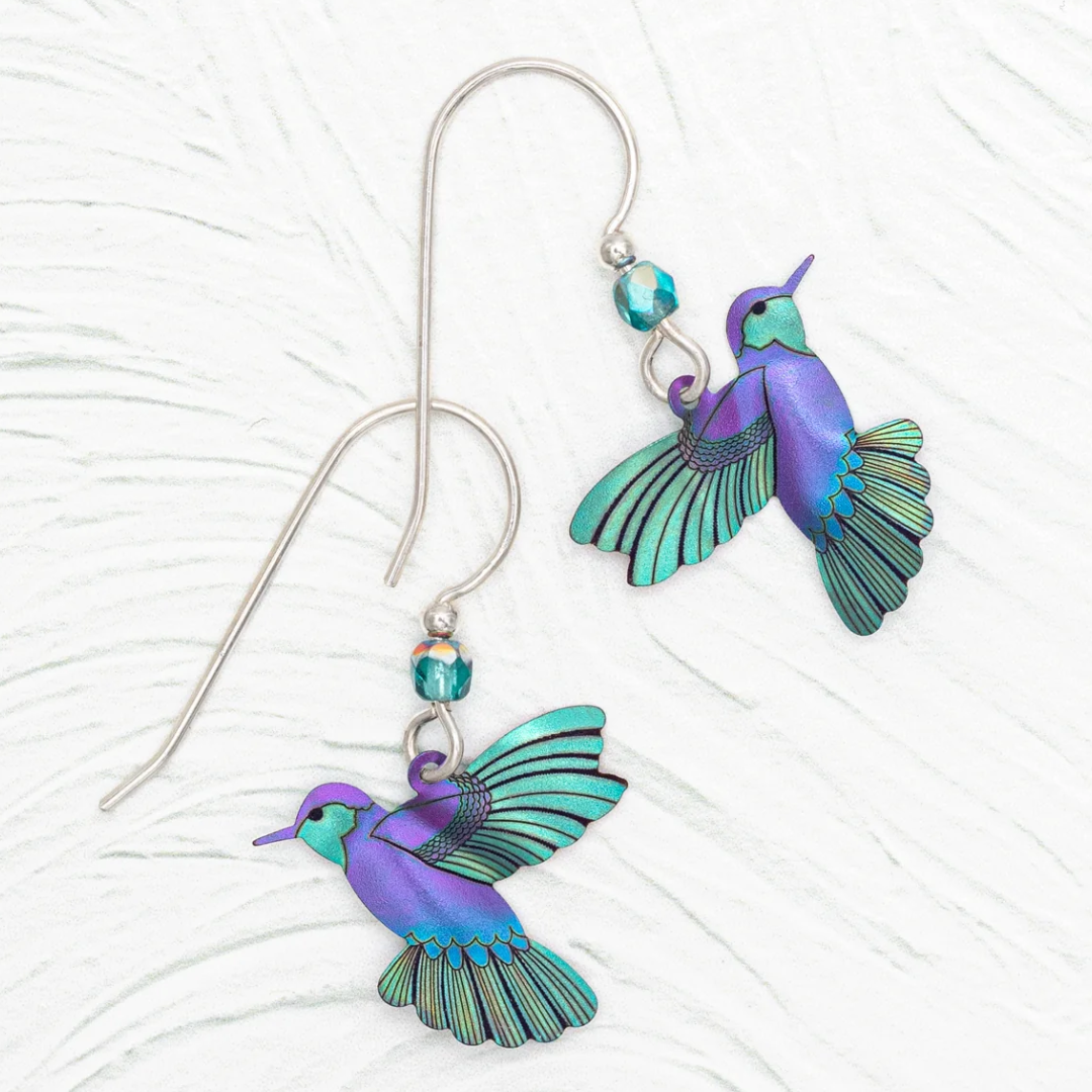 Holly Yashi Picaflor Hummingbird Dangles made out of Niobium. Color is Ultra Violet with 925 Sterling Silver earwires adorned with a blue Swarovski crystal