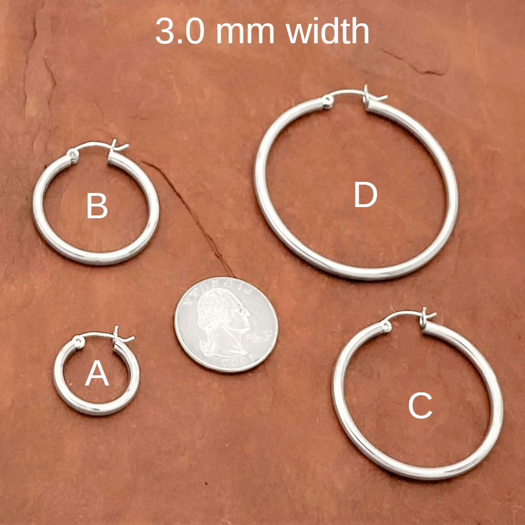 Four sizes of 925 Sterling Silver 2.5mm clip clasp hoops compared to a quarter