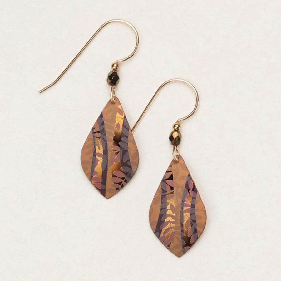 Introducing the Holly Yashi Riverwind Earrings: elegant, teardrop-shaped pieces with gold and purple-toned patterns hanging from gold fishhook ear wires. Adorned with small black beads near the hooks, these earrings showcase a leaf-like design with intricate detailing, capturing a touch of botanical beauty.