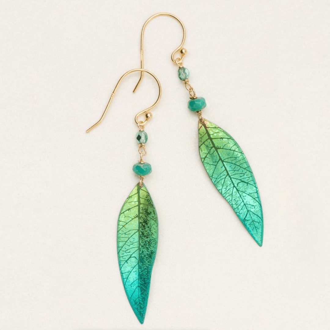 Holly Yashi Shimmering Willow - Green-to-blue gradient leaf dangle earring with venations etched into the metal work. At the top of the leaf are two green beads, separated by a gold chain on a gold-filled ear wire.