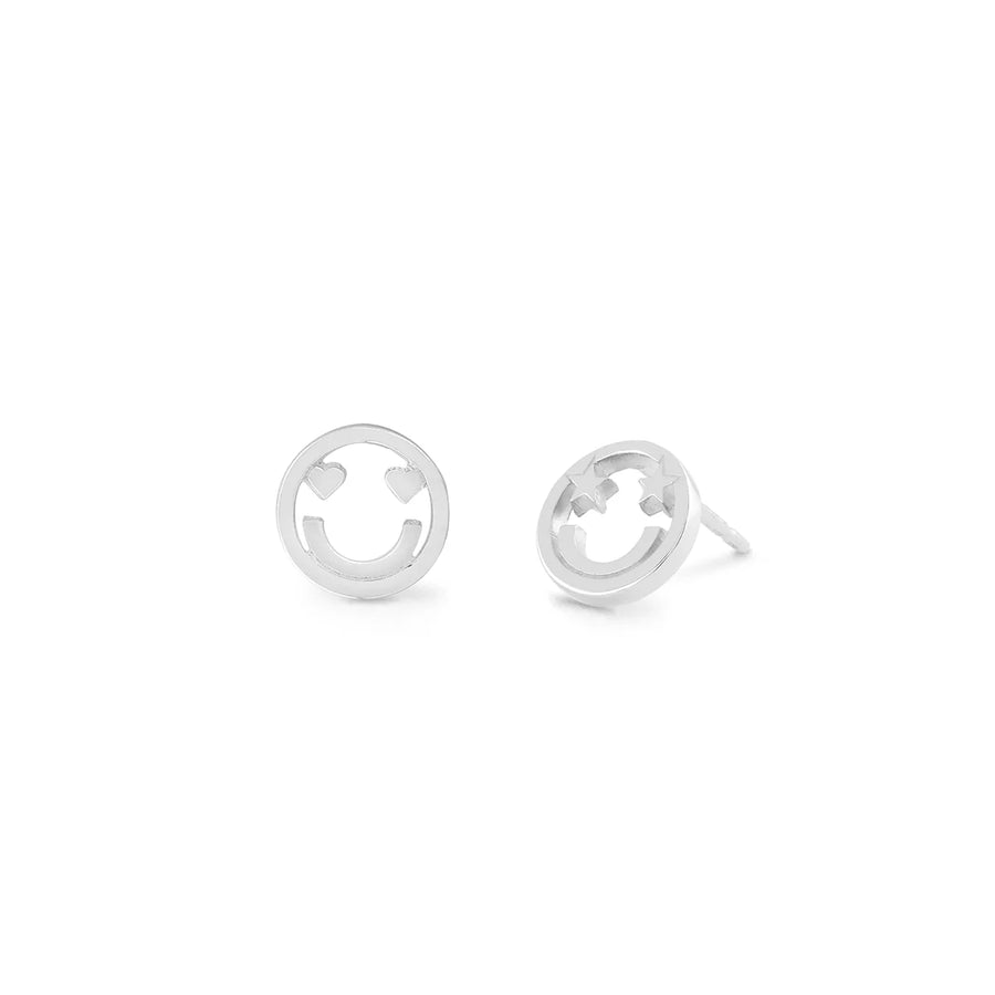 Introducing the Boma Happy Face Earring Studs, a charming pair of hypoallergenic silver earrings featuring smiley faces. Each earring showcases a circular face with two heart-shaped cutouts for eyes and a curved line representing a mouth, all meticulously crafted from 925 sterling silver. The earring posts are elegantly displayed against a plain white background.