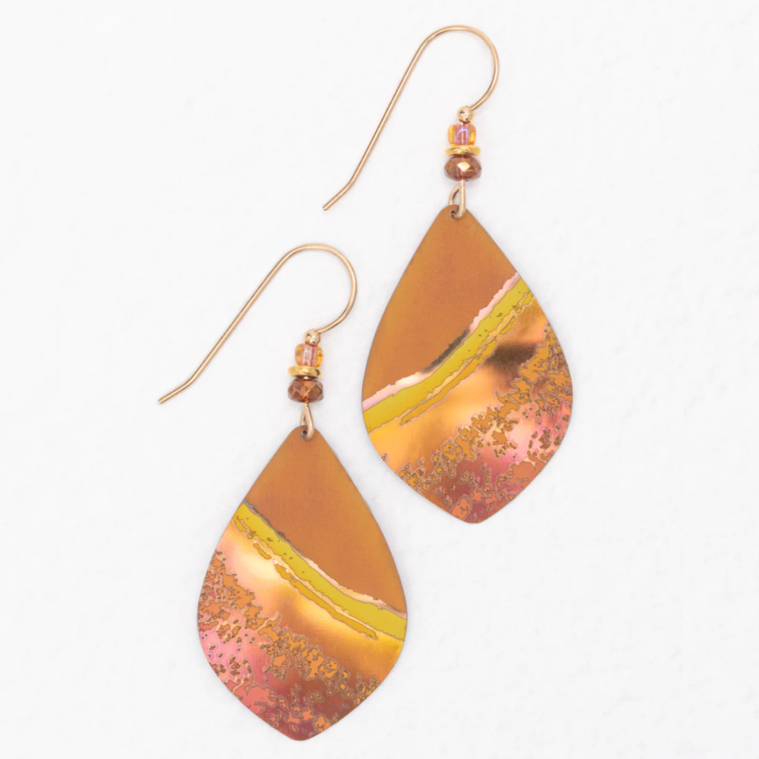 Holly Yashi Shorebreak Earrings - Golden Shore - Orange with yellow gash and speckled lighter peach niobium in an overall pointed teardrop shape - pink and orange beaded gold overlaid earwires.