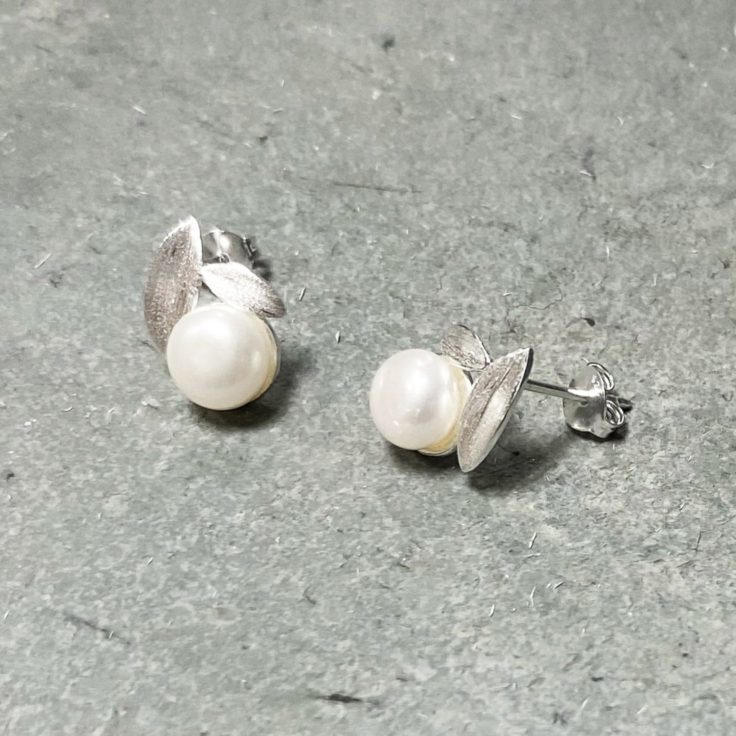 Freshwater white pearl with two small silver leaves on a 925 Sterling Silver post stud