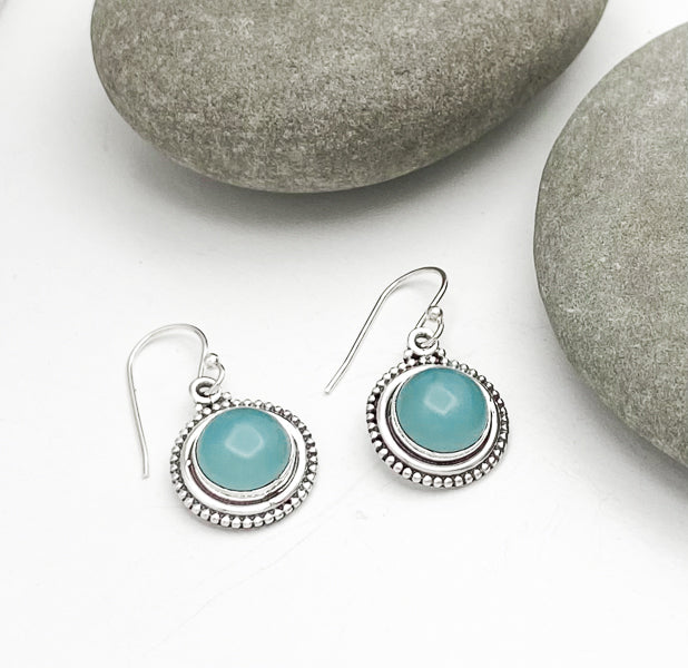 Round sterling silver dangle earrings. .6 inches in diameter. Blue grey in color. Beautiful hand made settings