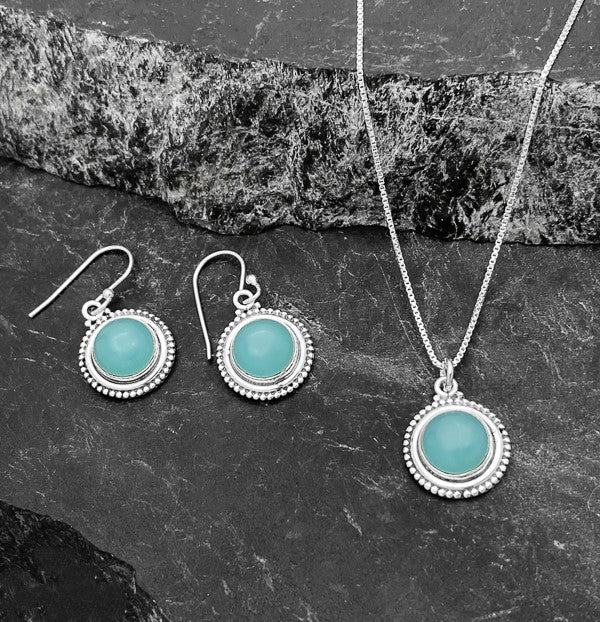 Round sterling silver dangle earrings. .6 inches in diameter. Blue grey in color. Beautiful hand made settings