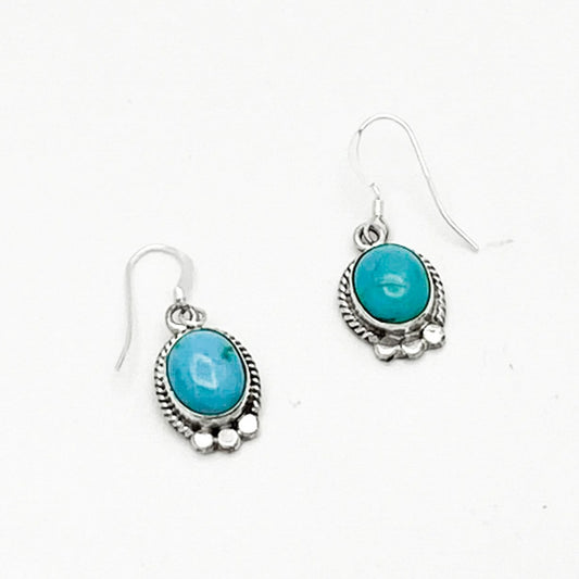 Small ovular Navajo Turquoise in 925 Sterling Silver braided setting with 3 flattened silver spheres adorning the bottom - 925 Sterling Silver earwires - Artist: Hallmarked - Sharon McCarthy from New Mexico