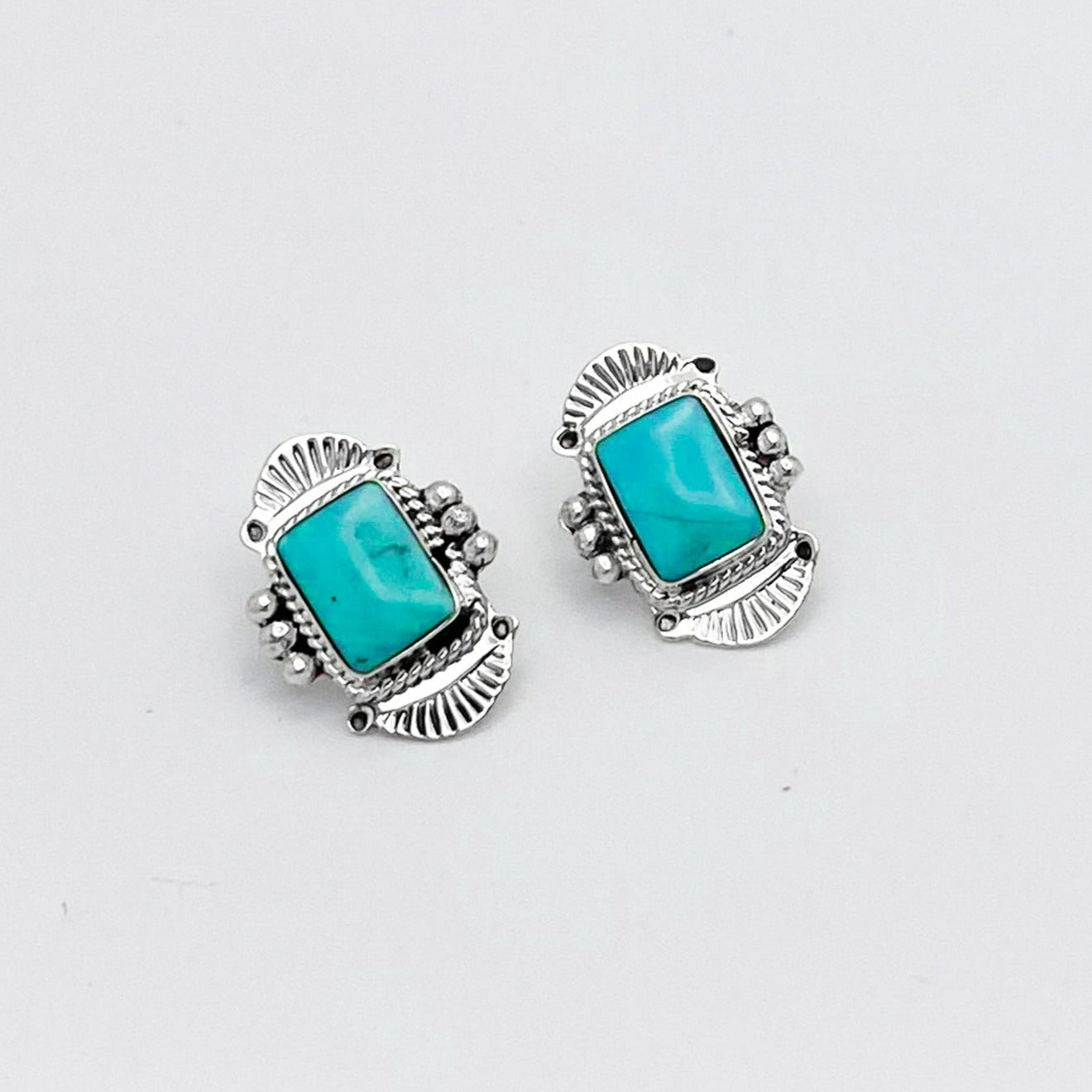 Small square Navajo Turquoise in southwestern fan themed stamped 925 Sterling Silver setting with three silver spheres on either side of the stone - 925 Sterling Silver post studs - Artist: Hallmarked - Arlene Lewis from Gallup, New Mexico 