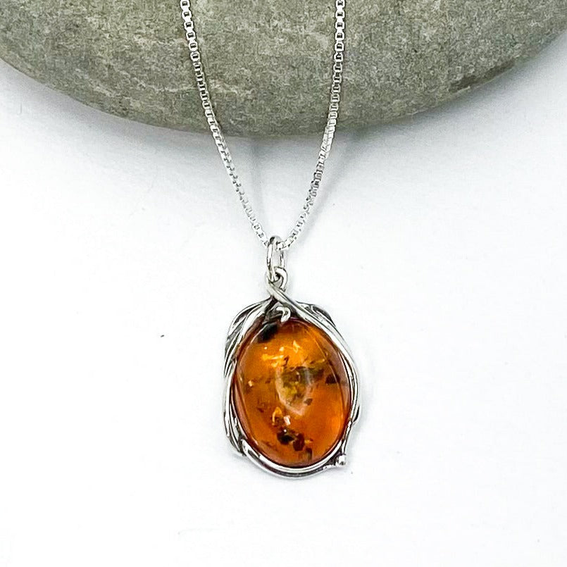 Urban Sterling Silver - Oval shaped Baltic Amber in floral / vine-like 925 sterling silver setting on 18" simple box chain