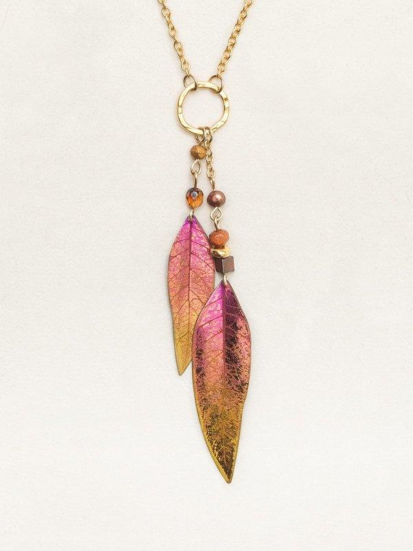 Red-to-orange gradient leaf with venations etched into the metal work. At the top of the leaf are two purple beads, separated by a gold chain. Leaves are attached to a gold circle, attached to a gold-filled chain.