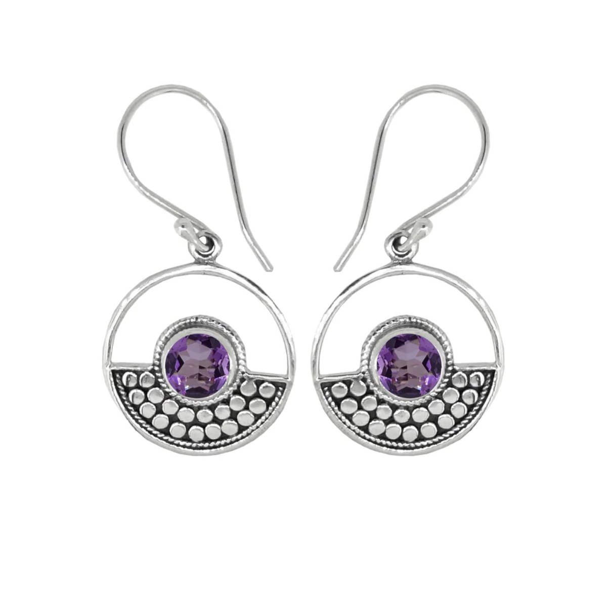 Sterling Silver design in a circle surrounds a circular amethyst stone on ear wires. Half of the circle is dotted with an oxidized sterling design, the other half is open.  On a plain white background. 