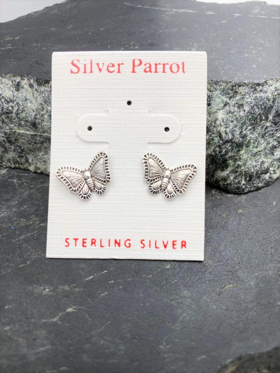 Sterling silver butterfly stud earrings displayed on a white Silver Parrot jewelry card.