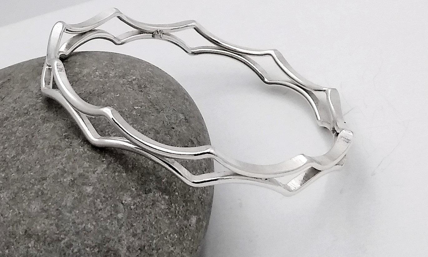 double strand bangle with offset diamond shape