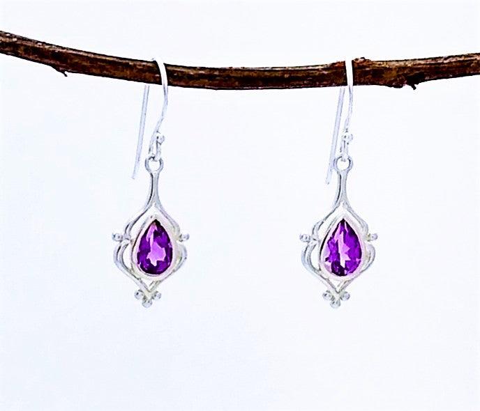 Boma teardrop shaped amethyst with elegant decorative silver setting on a french wire. 