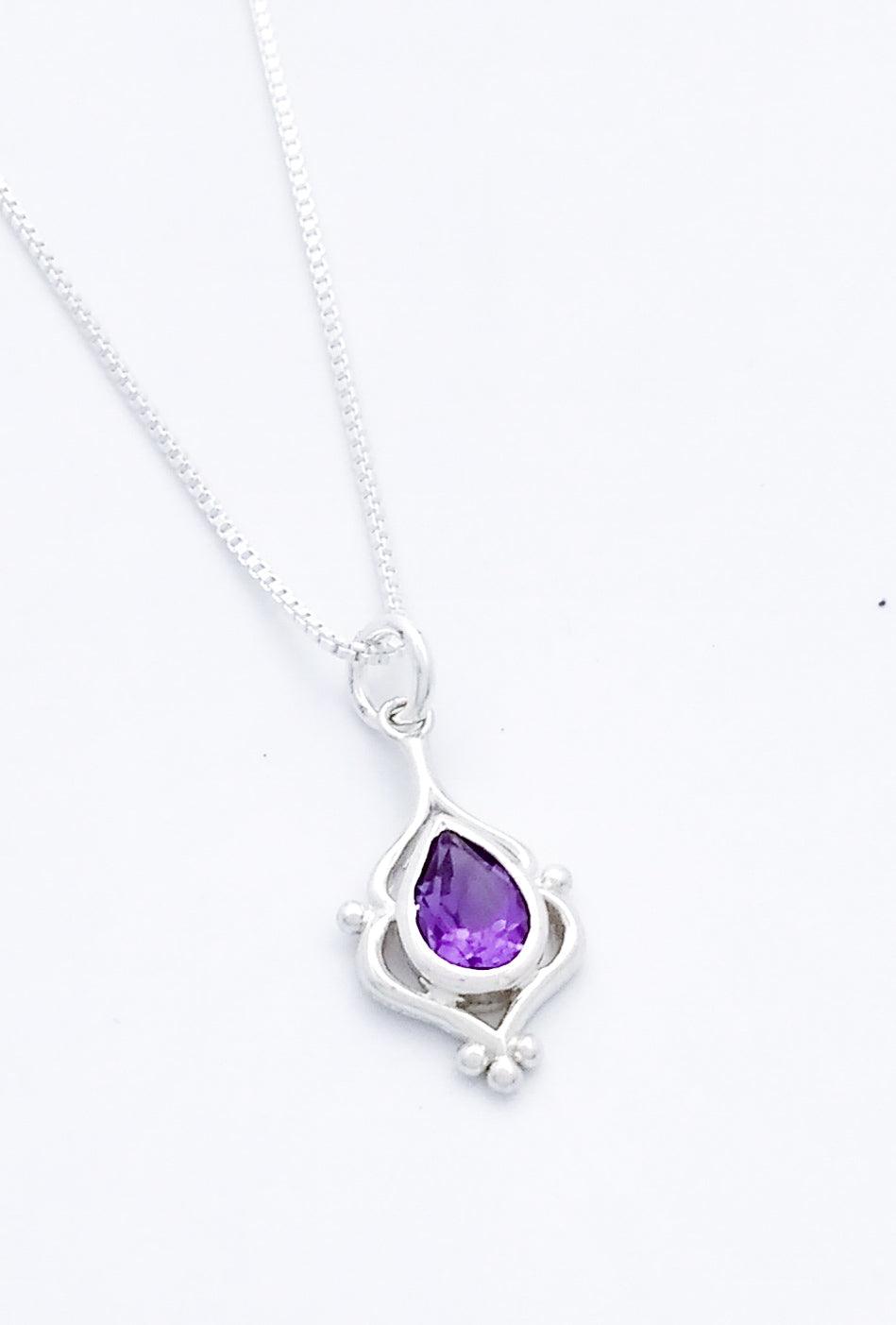 Teardrop shaped amethyst set in an elegant sterling pendant