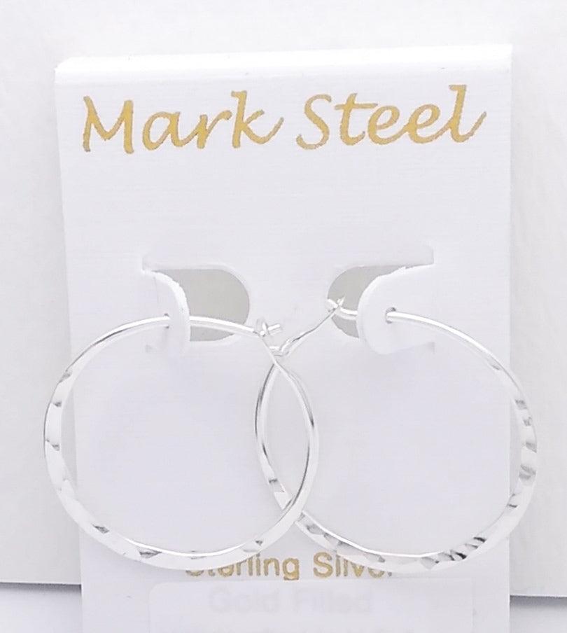 hammered silver hoop earrings on mark steel brand earring card