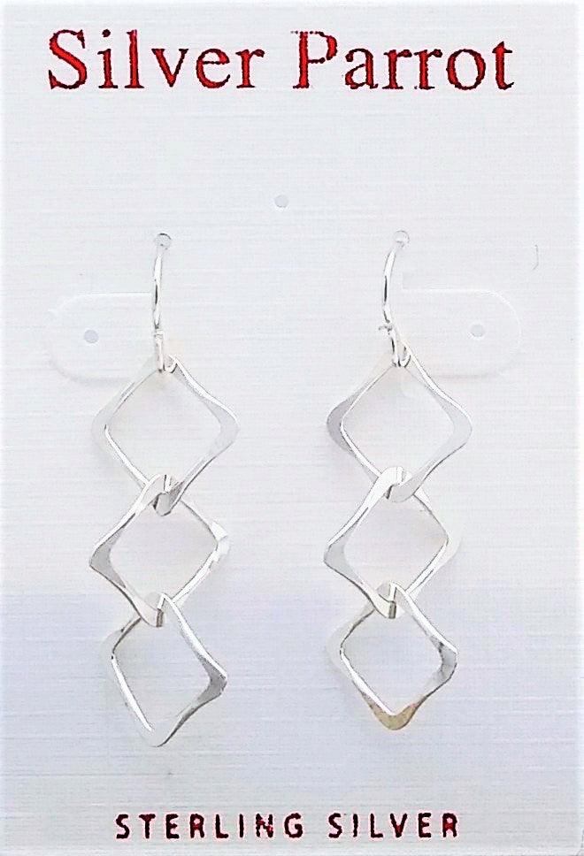Sterling silver dangles with three hammered intertwining squares on a French wire.