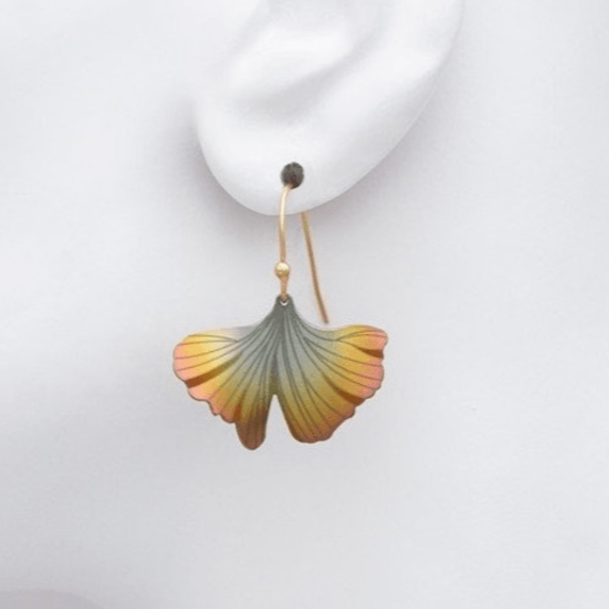 gold ginkgo leaf dangle earring on a gold-filled ear wire size comparison to a mannequin ear