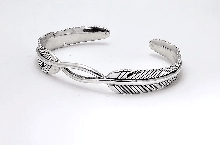 silver cuff bracelet with feather design