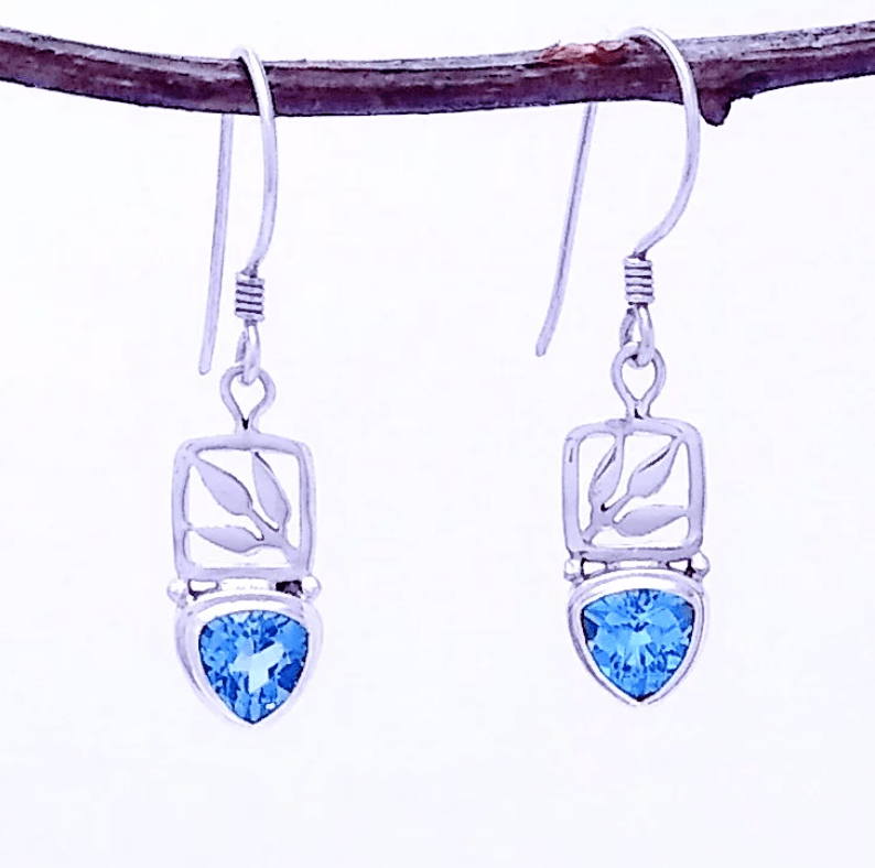 Silver earring with Blue Topaz in a leaf setting. 1.5" long.