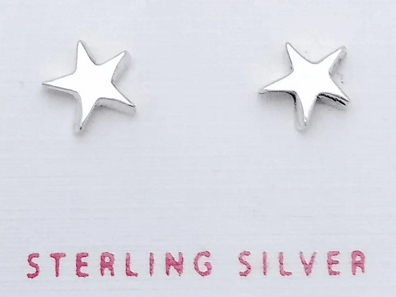 Silver 5-point star Studs on a card that says "sterling silver"