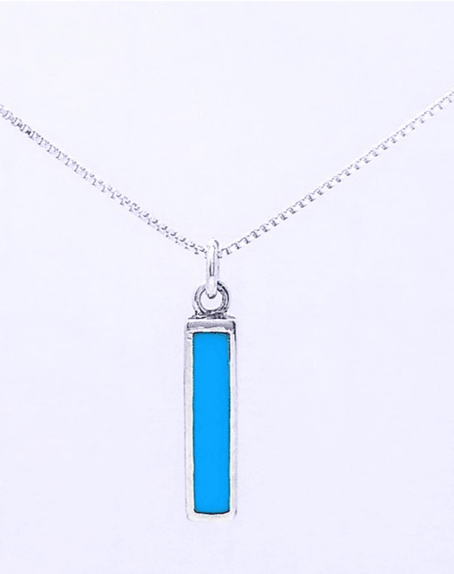 Solid color turquoise bar set vertically in sterling silver. A silver jump ring connects it to an 18 inch box chain