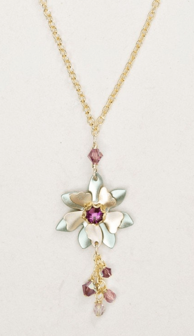 Floral design Holly Yashi earrings. Five bronze-colored petals wire with a burnished finish stretch out from the center of the design, which contains a deep purple swarovski crystal. Behind the petals are seven leaves attached to a similarly bronze-colored adjustable chain. Dangling from the bottom of the floral design are four loose-hanging Swarovski crystals attached to a similarly bronze-colored chain.