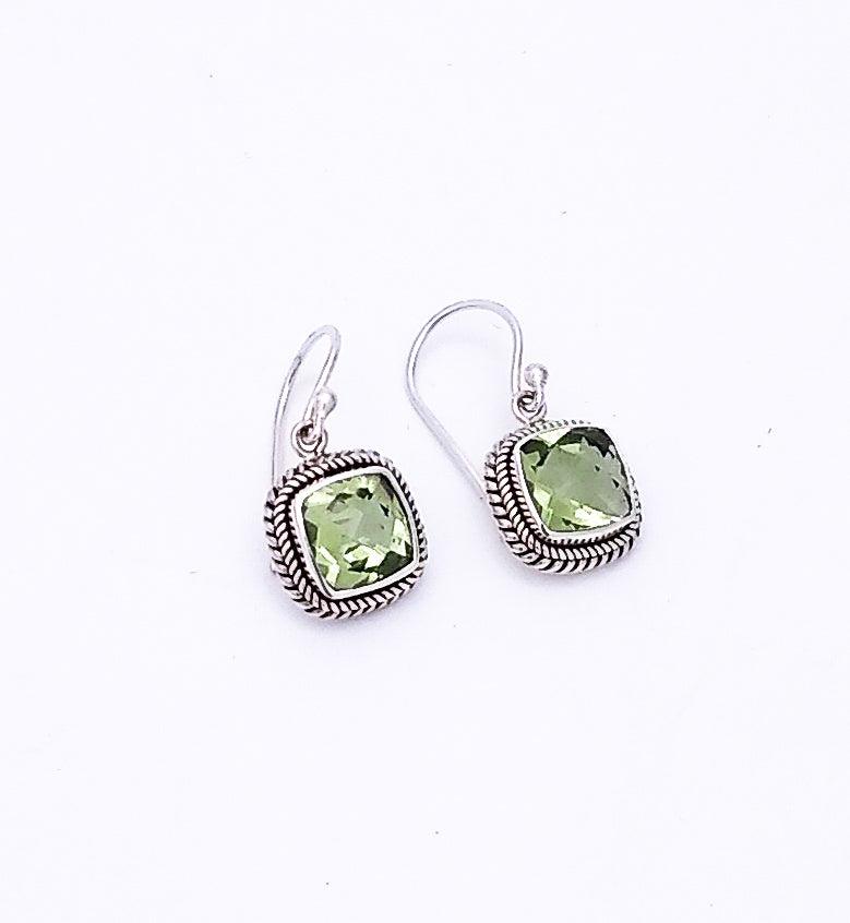 Sterling silver square dangle earrings with an ornate Bali rope design surrounding a green Amethyst. Birthstone for February