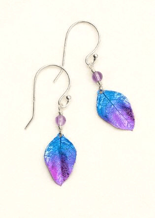 Blue and purple niobium leaf dangling earrings with venation leaf veins etched in the metal on a sterling silver ear wire. At the top of the leaf is a purple bead.