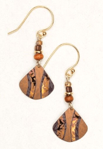 Triangular orange niobium pendant dangles from the bottom, etched in the metal are floral designs. At the top there are orange and yellow beads, dangling on a french wire.