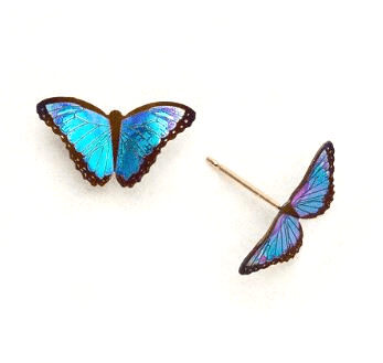 bright blue realistic butterfly on a gold post