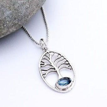 silver tree of life pendant with blue topaz