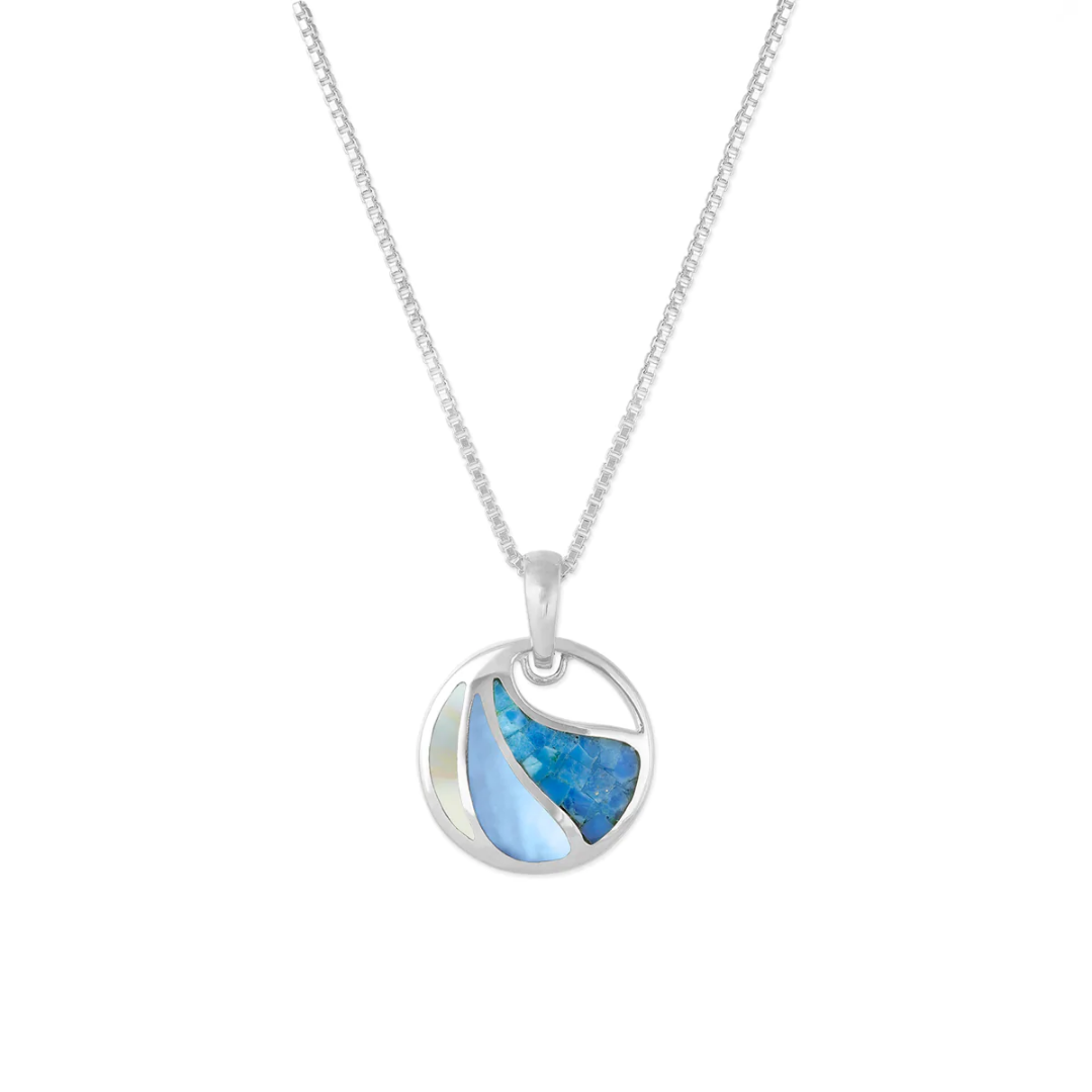 Sterling silver Boma circle with three separated sections of fractured blue Mother of Pearl, dyed blue Mother of Pearl, and natural Mother of Pearl with a cut-out at the top. Comes with 18-inch silver chain.