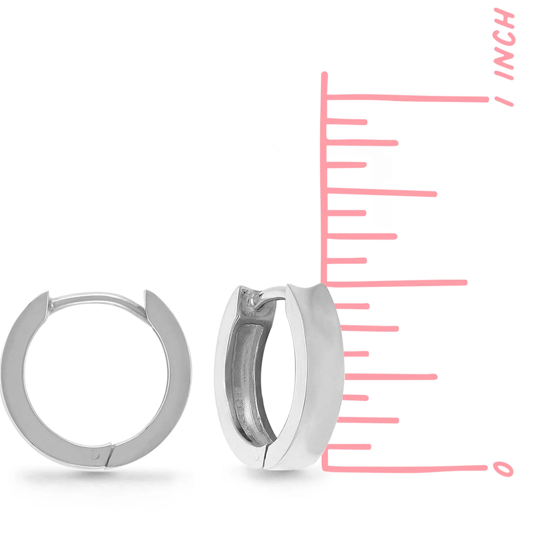 Made by boma. Snaptop Huggies in sterling silver. .5inch Sterling hoops. Seen on white background in both front and side view next to measuring tape, showing the .5 inch measurement.