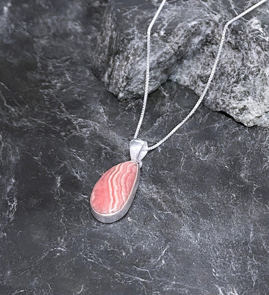 Rhodochrosite Pendant Set In Sterling.Includes 18 inch sterling chain. Urbansterlingsilver.com - Silver Parrot, Inc. 