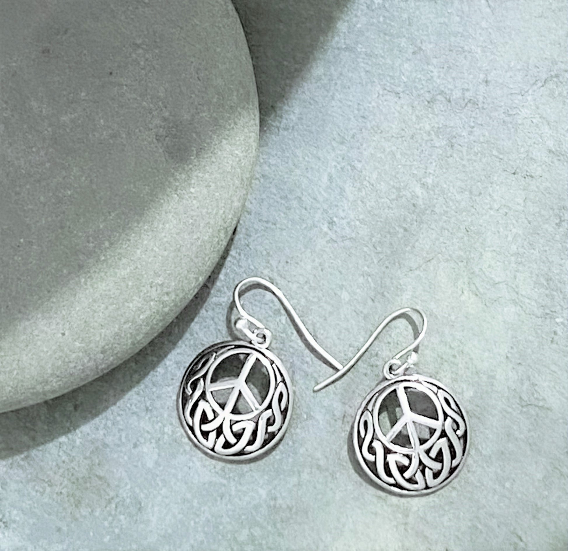Round Celtic Knot dangle peace sign earrings. !.25" long. urbansterlingsilver.com